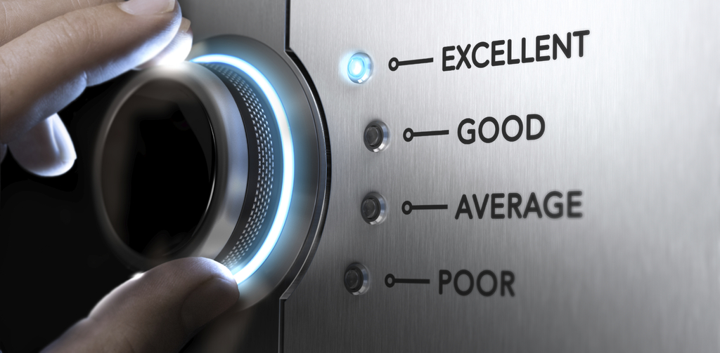 Hand turning a knob to the top position, blue light and blur effect. Concept image for excellent customer service.