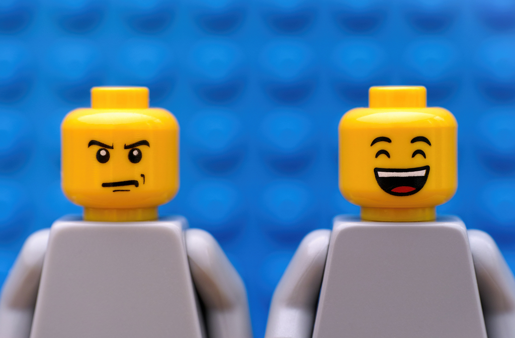 Two Lego minifigures - strict and happy